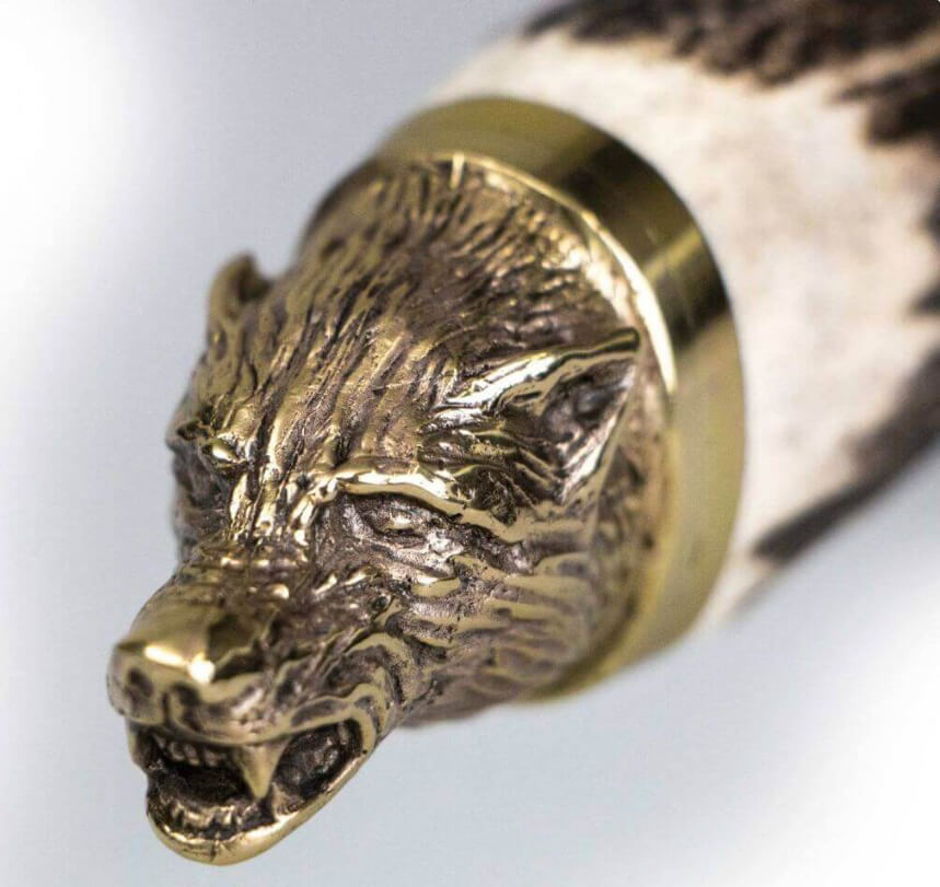 Jagdmesser Muela Wolf-16A mit Hirschgeweihgriff und dekorativem Wolfskopf